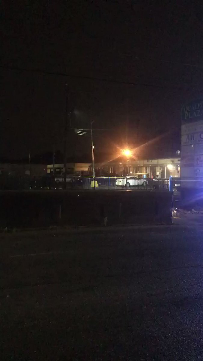 Crime scene tape is up outside this shopping center on Joseph E Boone