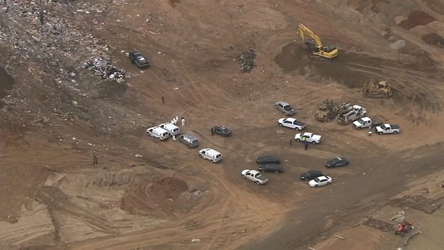 Police are working to identify a body found dumped at a DeKalb County landfill