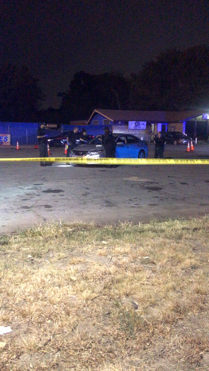 CSI investigators taking photos of the car with bullet holes. Shooting investigation at The Chill Spot 