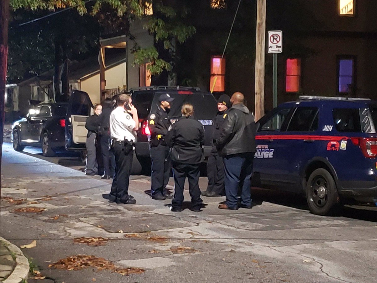 Police say two masked men carrying firearms entered an AirBNB property on Wylie St, demanding the victims' phones, wallets and shoes around 2:30am. One victim was struck in the head.