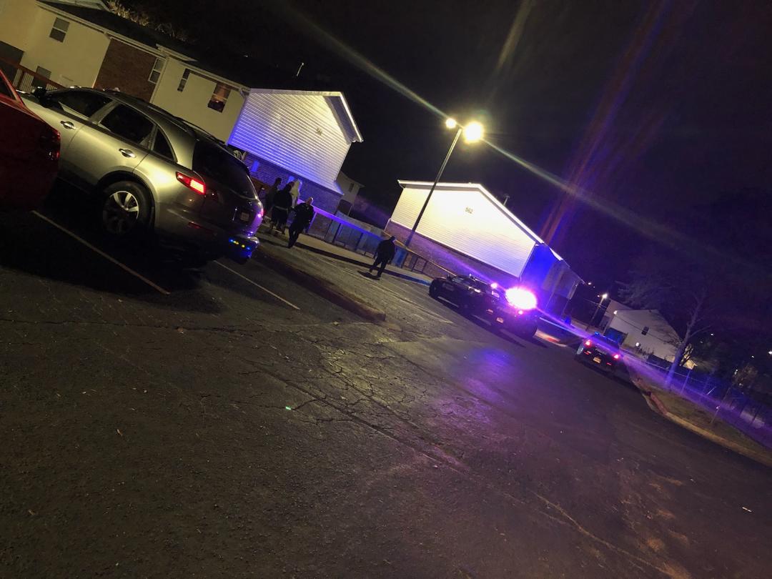 Police searching for shooter who fired shots at an apartment building. Police said a person inside the apartment who cut their foot on broken glass was treated at the scene with minor injuries.