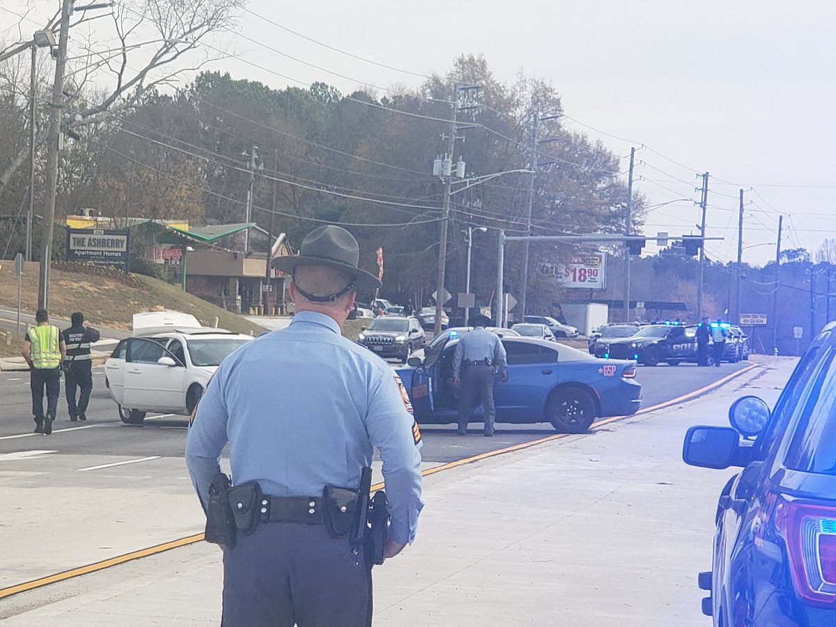 One man handcuffed and put into DeKalb cruiser. Chase ends in crash on Flat Shoals. One man is shot on 285 EB.