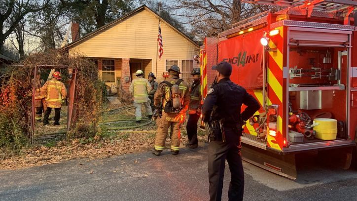 A woman was seriously burned after being pulled from a fire at a home in southwest Atlanta.