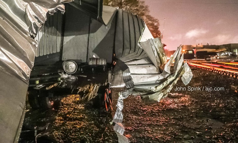 Train collides with truck hauling cases of beer in McDonough