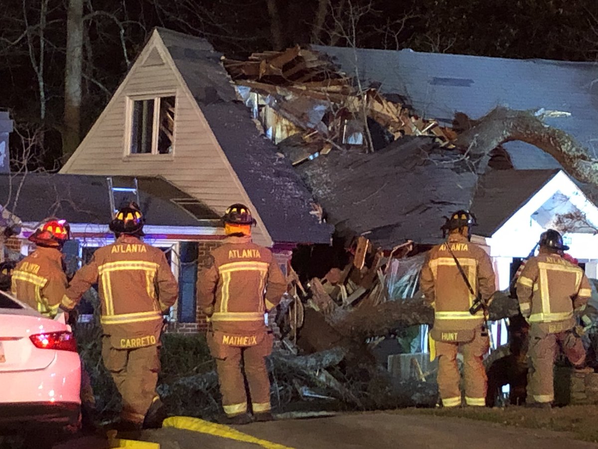 Woman, possibly in her 70's, is still trapped in this home on Ridgemore Road in NW Atlanta. 