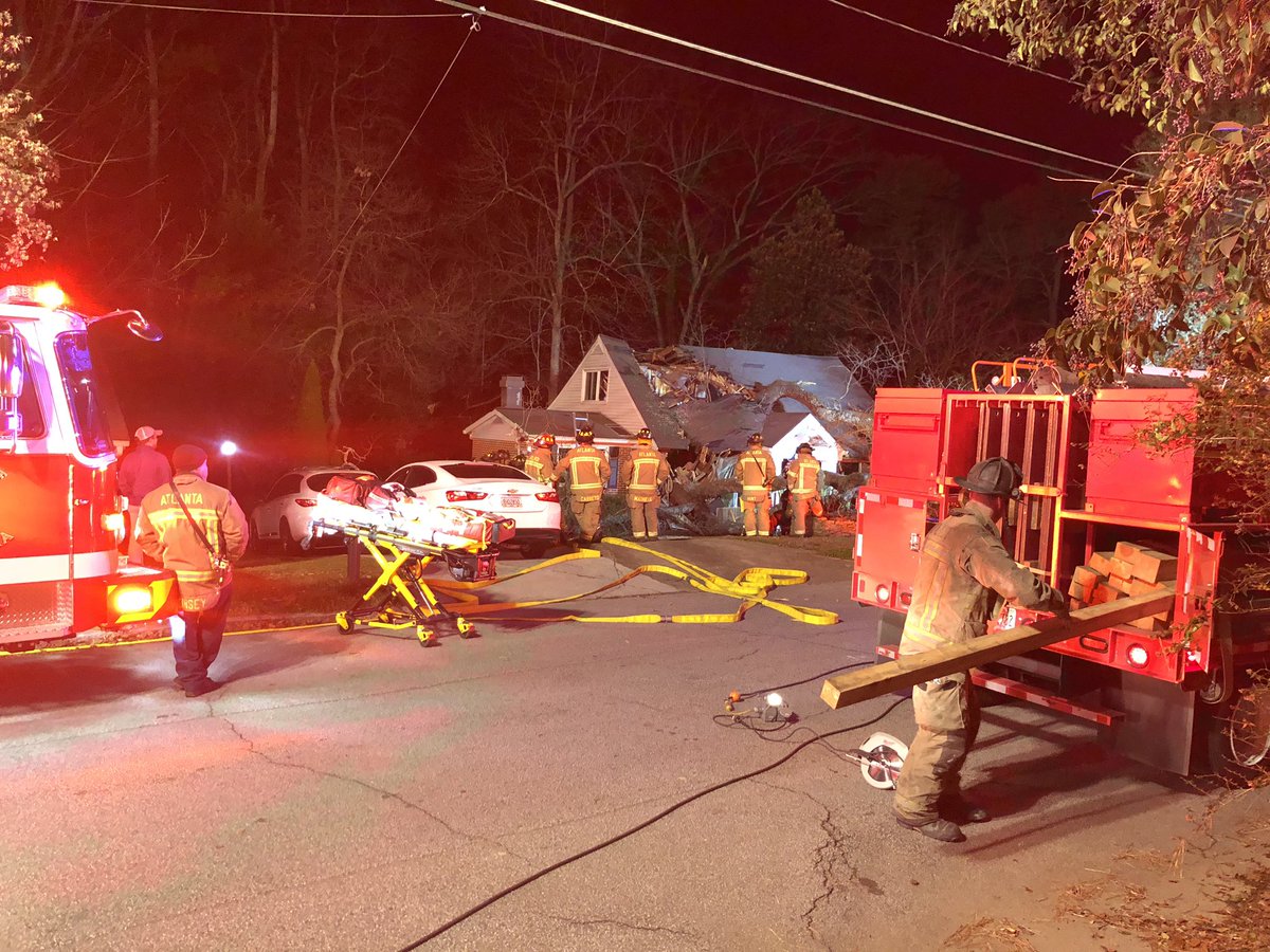 Woman, possibly in her 70's, is still trapped in this home on Ridgemore Road in NW Atlanta. 