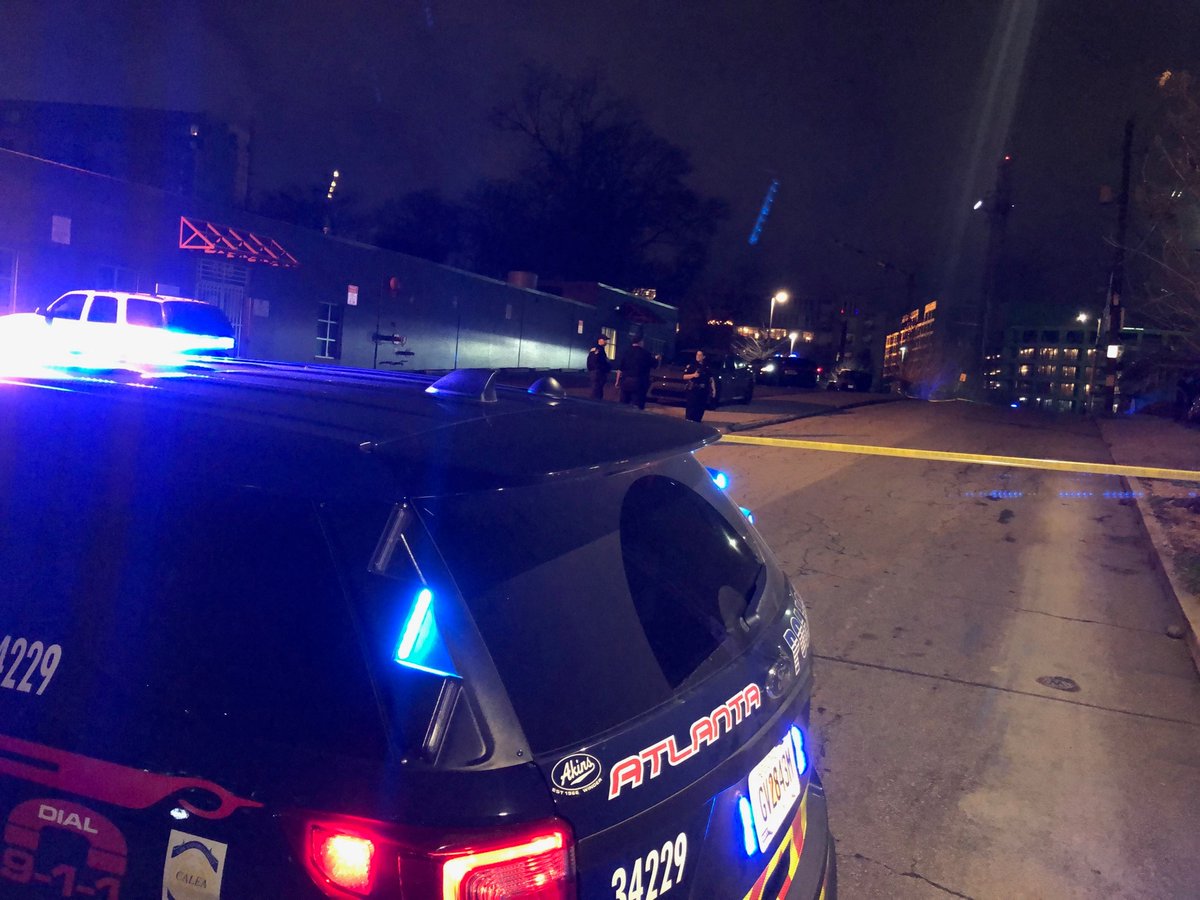 Atlanta police are trying to track down three men who they say fired shots at a building that houses a recording studio