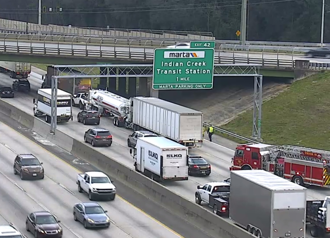 Big trucks while driving on the interstate. 3-4 tractor trailers involved, and a pick up truck crushed