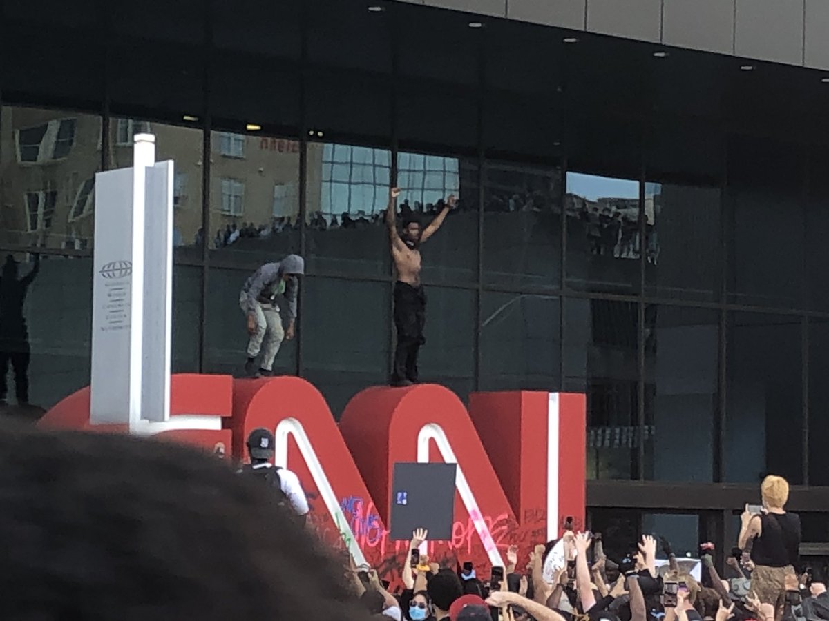 Some protesters vandalized the @CNN sign