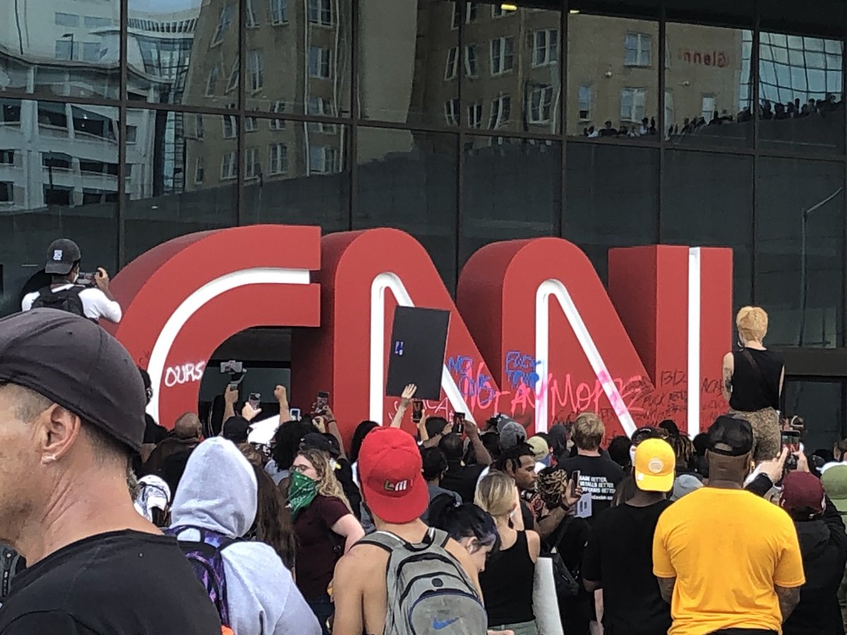 Some protesters vandalized the @CNN sign