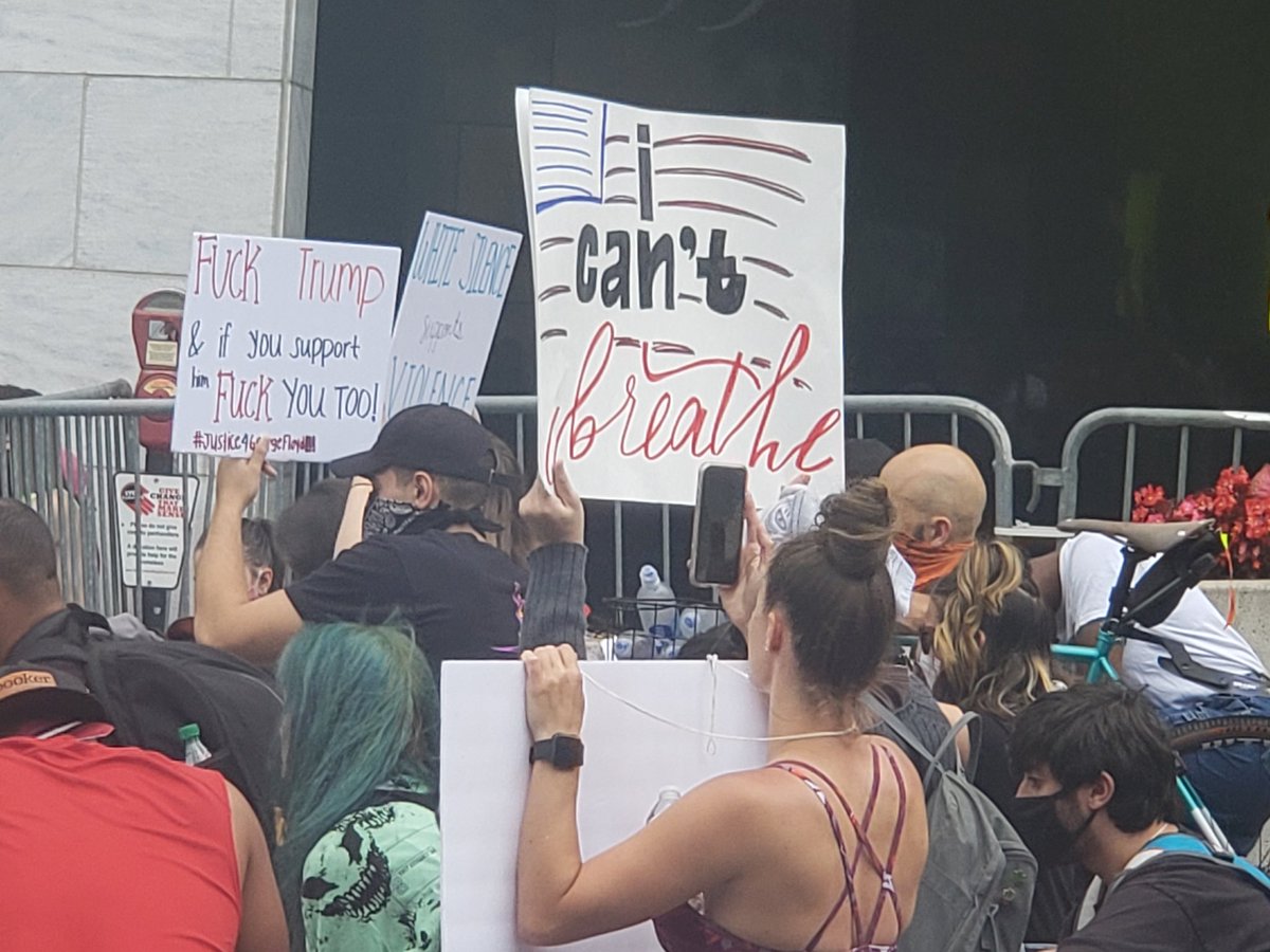 Protestors kneel for a moment of silence for all those who have died at the hands of police officers at Atlanta City Hall.