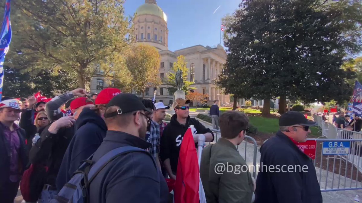 Nick Fuentes and Ali Alexander departing the scene at the end of this Thursday's Stop the Steal protest and march around the Capitol Atlanta Georgia 