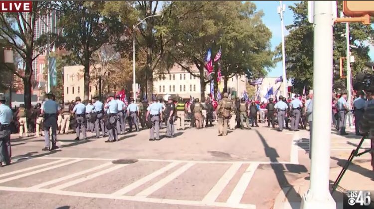 Police line up in riot gear with Georgia State Patrol at StopTheSteal protest outside State Capital