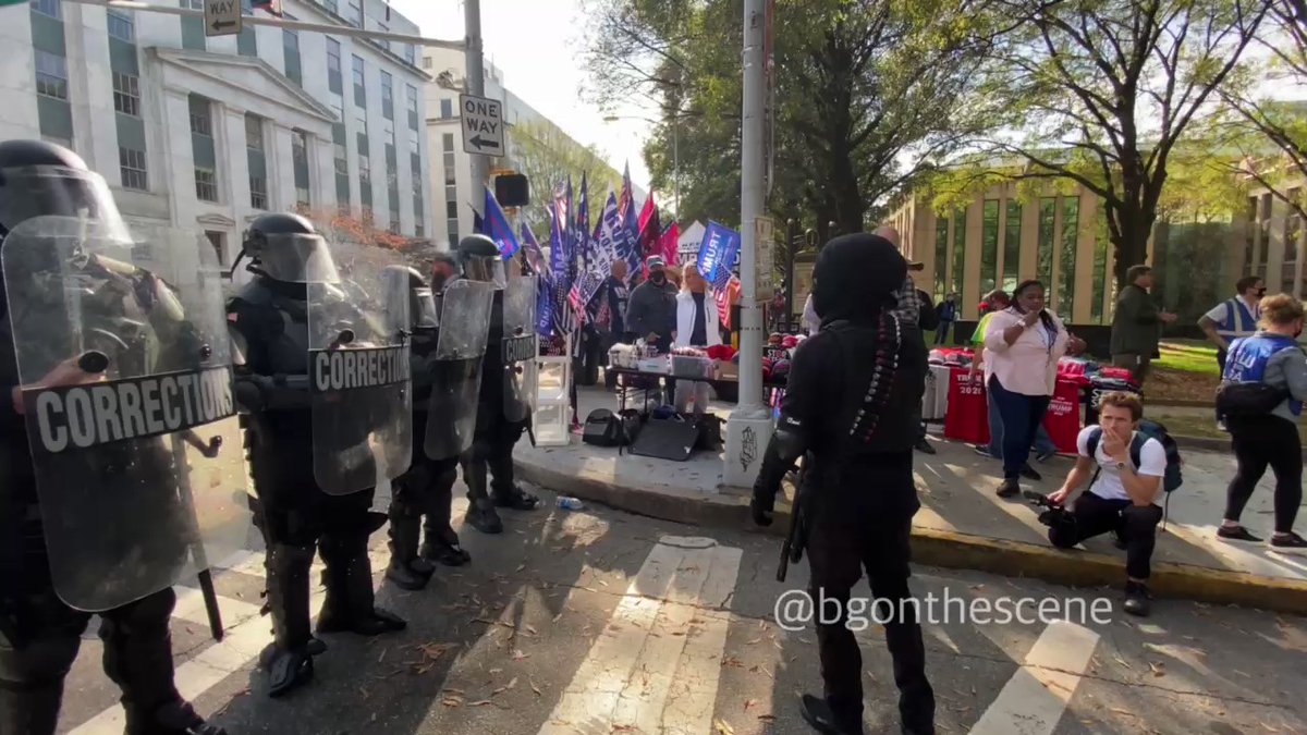 One of the armed protesters from the Black Lives Matter side confronts the line of riot police  Atlanta Georgia A