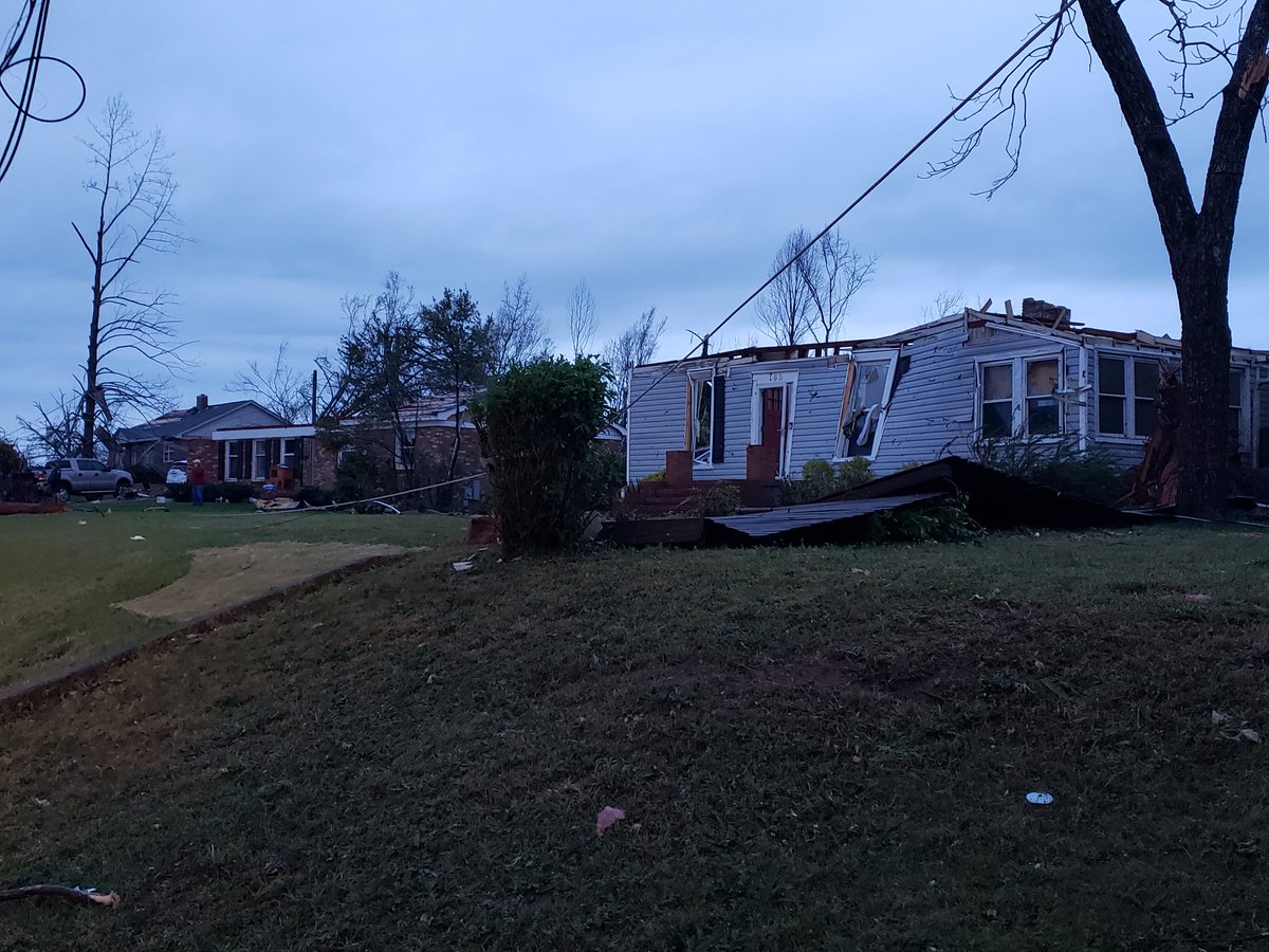 As daylight approaches tornado damage in Newnan GA becomes easier to see. This photo taken right across the street from the High School. Similar scenes all over town.