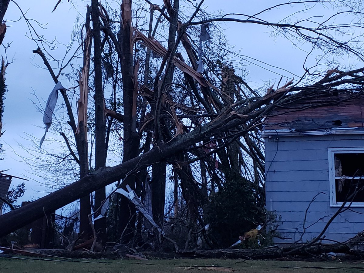 As daylight approaches tornado damage in Newnan GA becomes easier to see. This photo taken right across the street from the High School. Similar scenes all over town.