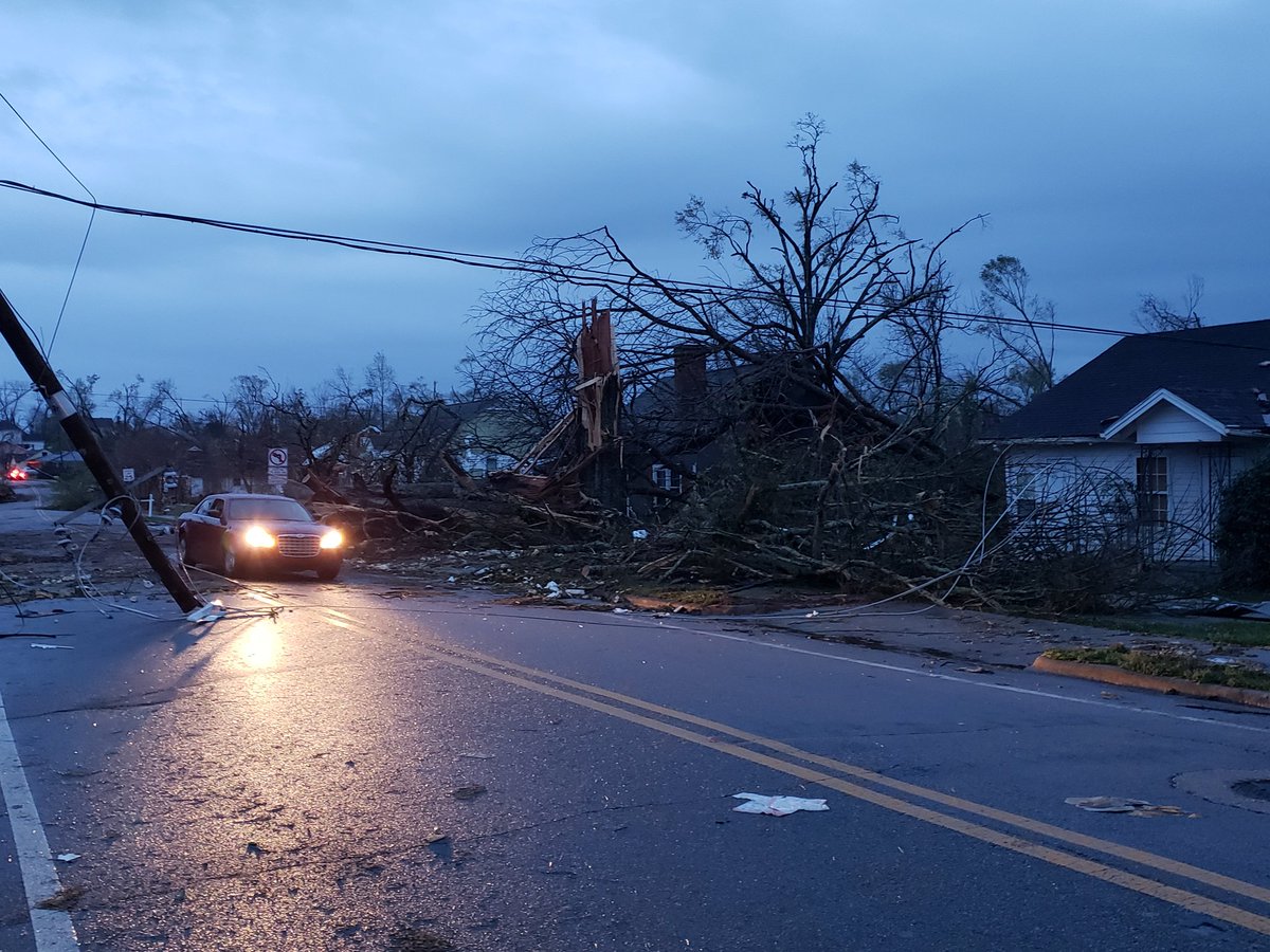 As daylight approaches tornado damage in Newnan GA becomes easier to see. This photo taken right across the street from the High School. Similar scenes all over town.