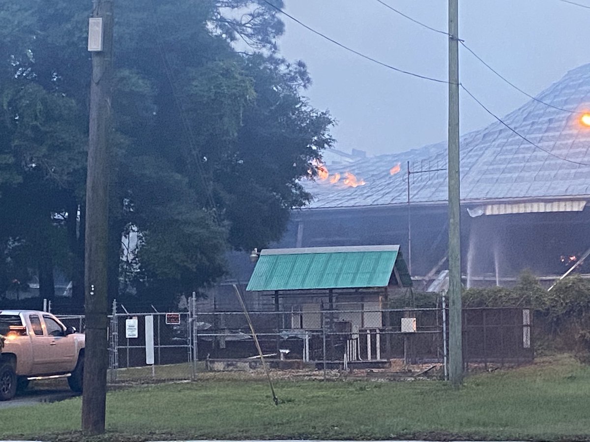 Now that the sun is coming up we could see where fire fighters are battling those flames and putting out hot spots at this wood pellet warehouse in Brunswick 