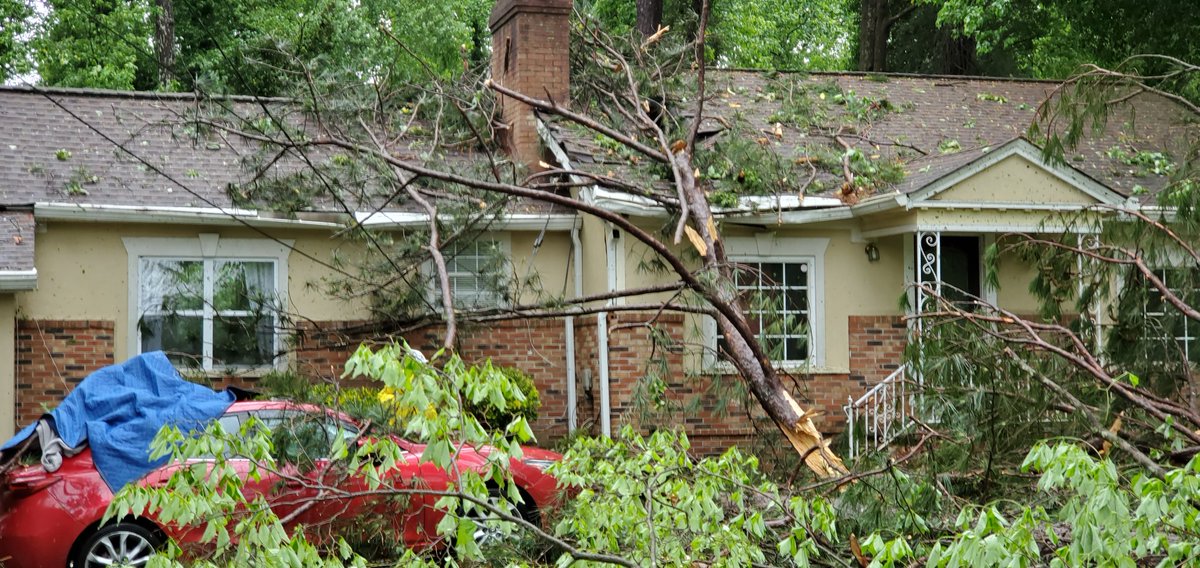 Storm and tornado damage in South Fulton near Atlanta. Trees on homes and trees across the street on Cascade Rd 