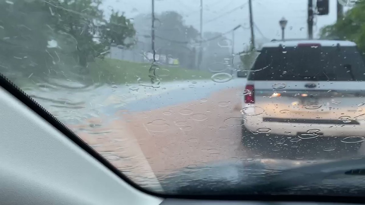 Glenwood Ave looks like muddy river in downpour in SE Atlanta