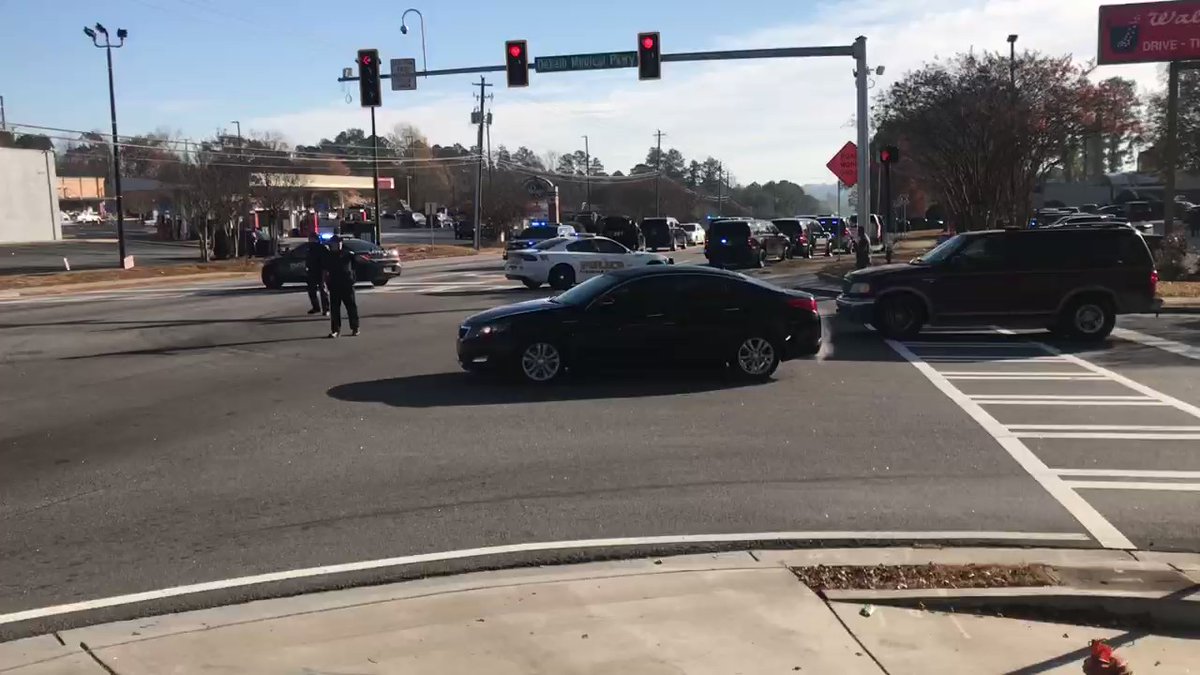 in Lithonia @DeKalb_Sheriff office says two of their investigators were shot  while trying to endeavor an arrest warrant. At last check the shooter is still on the loose, and the investigators are in the hospital.  