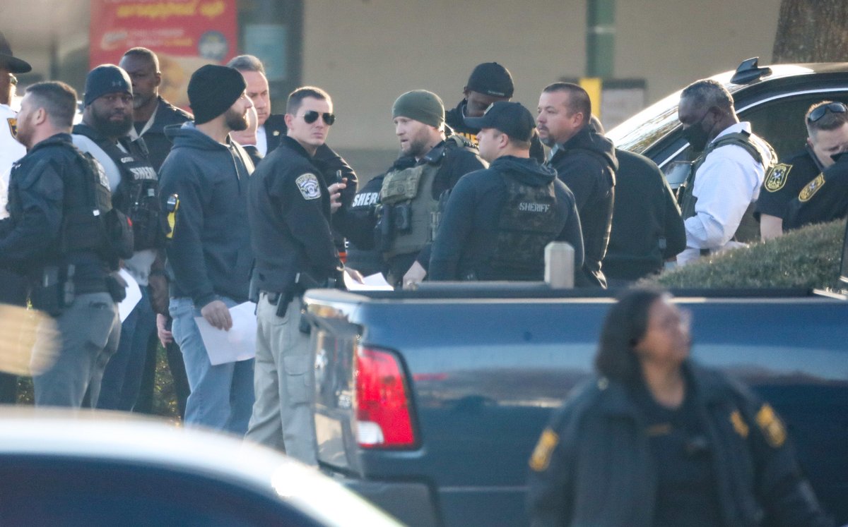 Authorities have shut down a major DeKalb County road as they pursue a suspect accused of shooting two sheriff's investigators on Wednesday morning. Both officers are expect to be okay 