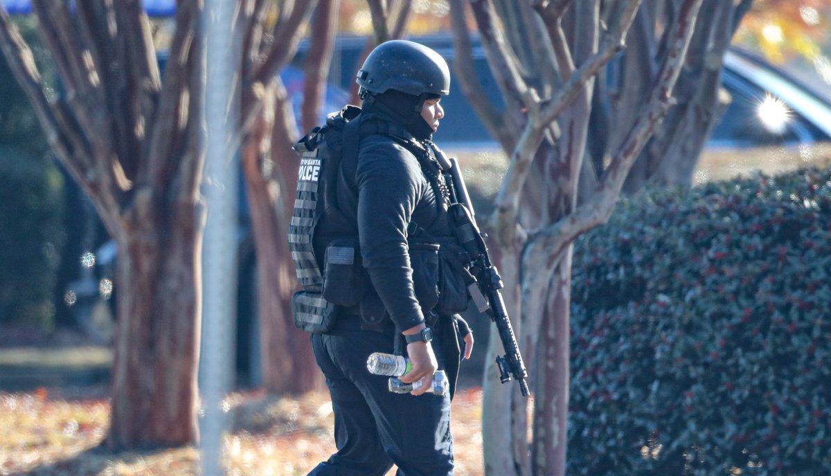 Authorities have shut down a major DeKalb County road as they pursue a suspect accused of shooting two sheriff's investigators on Wednesday morning. Both officers are expect to be okay 