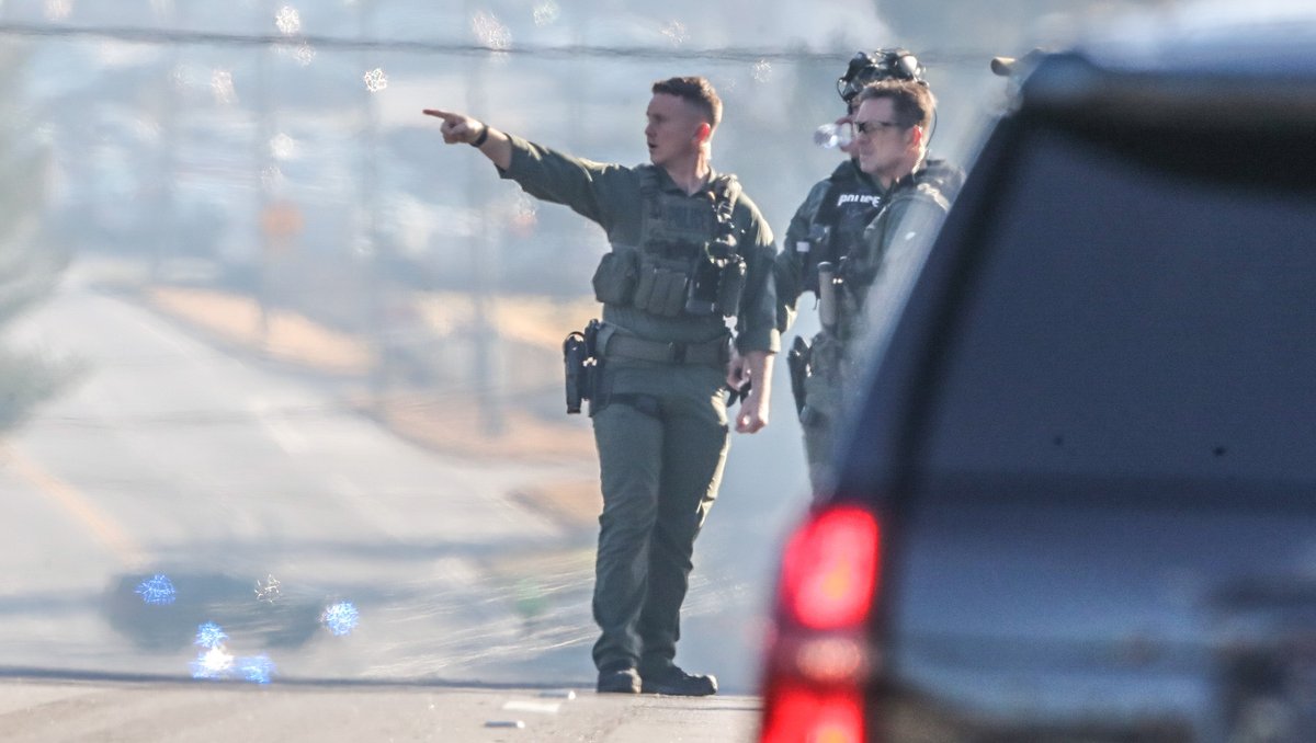 Authorities have shut down a major DeKalb County road as they pursue a suspect accused of shooting two sheriff's investigators on Wednesday morning. Both officers are expect to be okay 