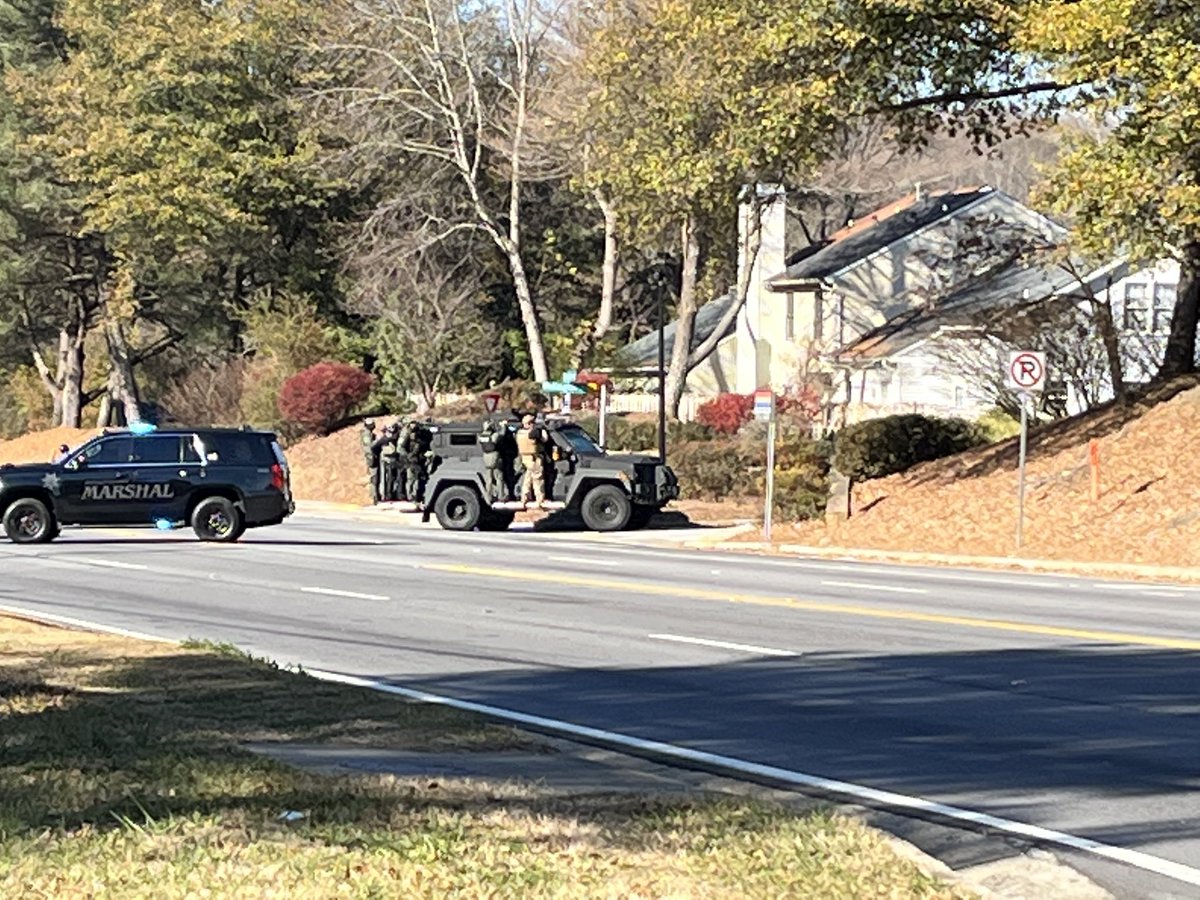 Full SWAT team went into neighborhood about an hour ago searching for suspect wanted for shooting two officersbut just moved out of subdivision