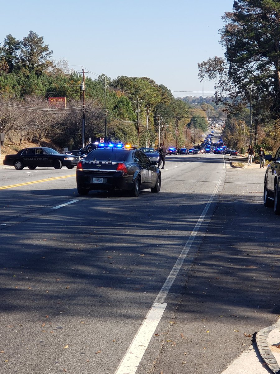 A sea of police lights in Lithonia.  waiting for confirmation that law enforcement has located Edward Gatling, who allegedly shot two DeKalb Co. Sheriff's deputies this morning