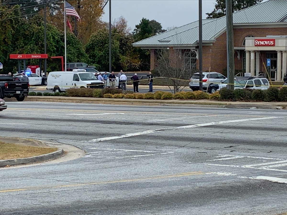 The coroner has arrived on the scene of an incident at Synovus Bank on Buena Vista Road in Columbus.