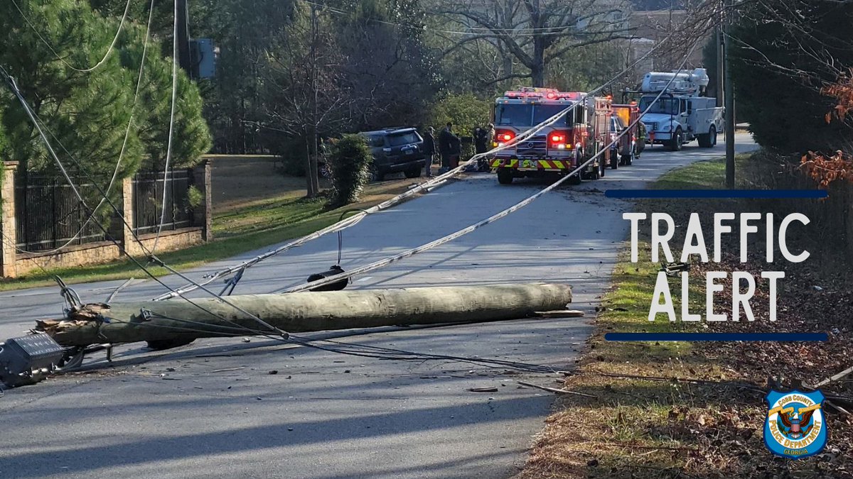 N. Mountain Road closed between Sandy Plains Rd and Summersweet Dr in Marietta due to wires down and a damaged utility pole. Avoid the area, expect delays, and plan alternate routes