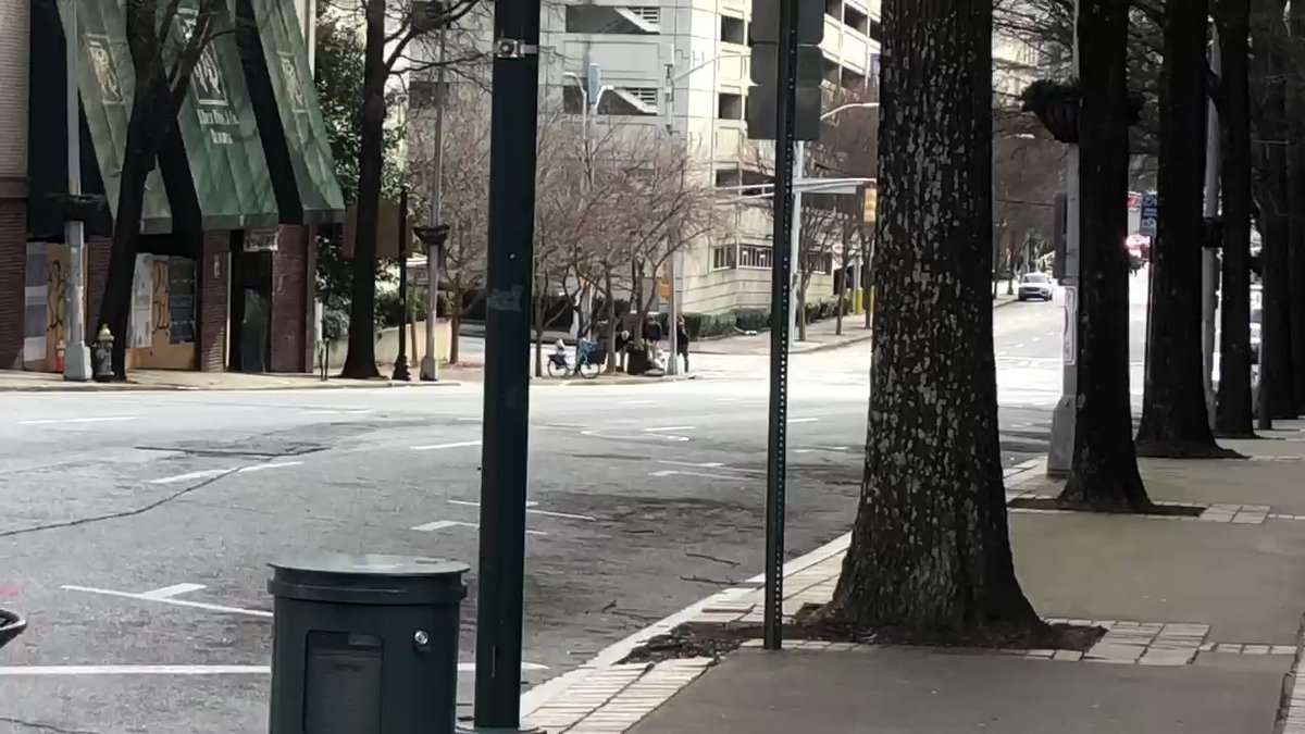 Looks like the bomb scare in downtown Atlanta is about to be over. Officers are gathering around the suspicious package now, moments after a bomb tech reached into it and the police robot pulled away