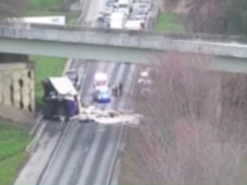 A tractor trailer is on it's side in College Park on I-285/sb (Outer loop) ramp to I-85/sb (Exit 61). The ramp is currently blocked.