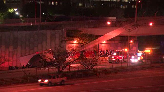 A tractor trailer crash in Atlanta has Pulliam St shutdown at Fulton St as crews work to remove the big rig and damaged fence hanging from the  Fulton St bridge. The I-20 ramps to I-75/85/sb are currently blocked now.