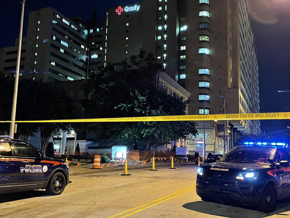 1 dead, another in critical after 3 gunmen open fire near ER entrance. APD says family members from a Dekalb incident showed up at the hospital, got into argument and then started shooting.