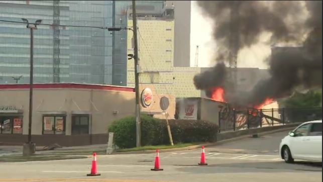 Flames at the corner of North Druid HIlls Rd & Briarcliff Rd in DeKalb County.  semitruck totally engulfed by fire here