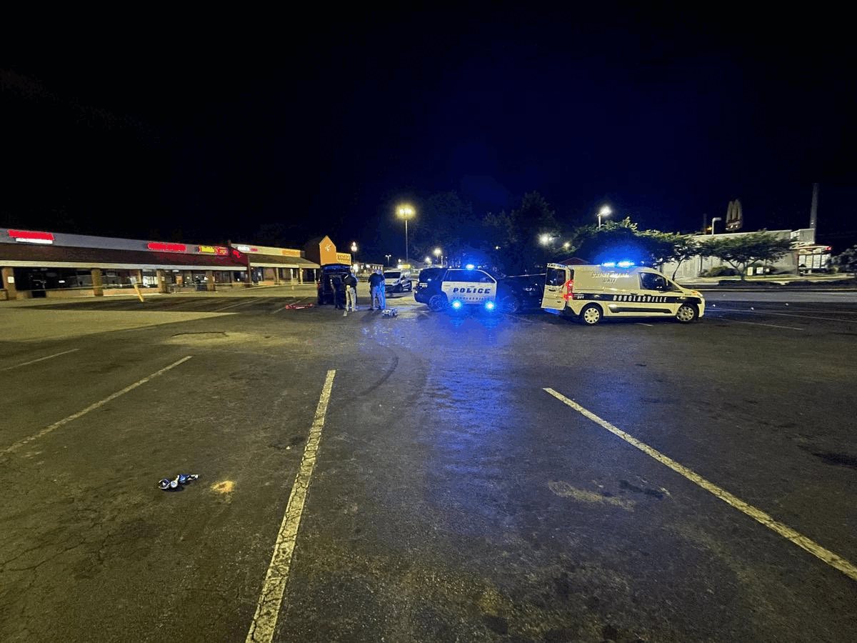 Murder at Douglasville shopping center. Victim's identity not released also no information about possible motive or suspect description.