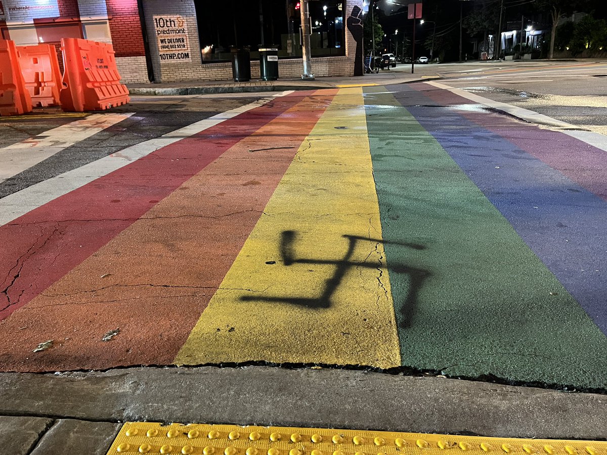 Rainbow Crosswalk vandalized again overnight with spray painted swastika. Atlanta Police say same suspect caught on camera also defaced nearby Federal Reserve