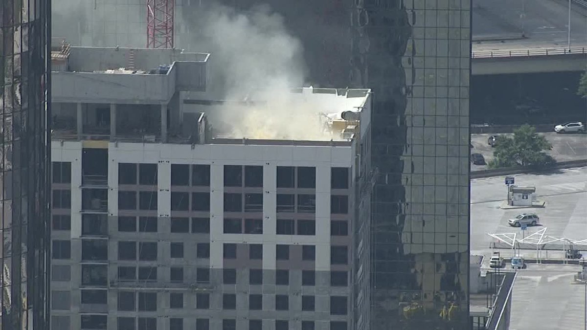 multiple agencies responding to a fire in downtown Atlanta. Ted Turner drive is shut down between Luckie St & Marietta. It looks like the building still under construction.