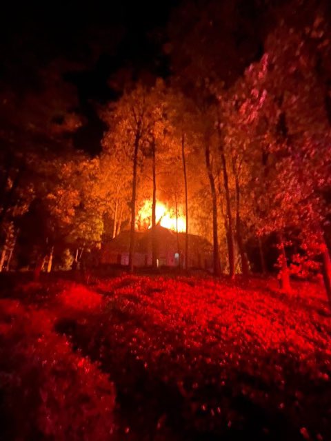 Photos from the Sandy Springs fire chief shows an active scene continues after a house fire on powers ferry road between N. Powers ferry and red ridge court. The road is closed in both directions