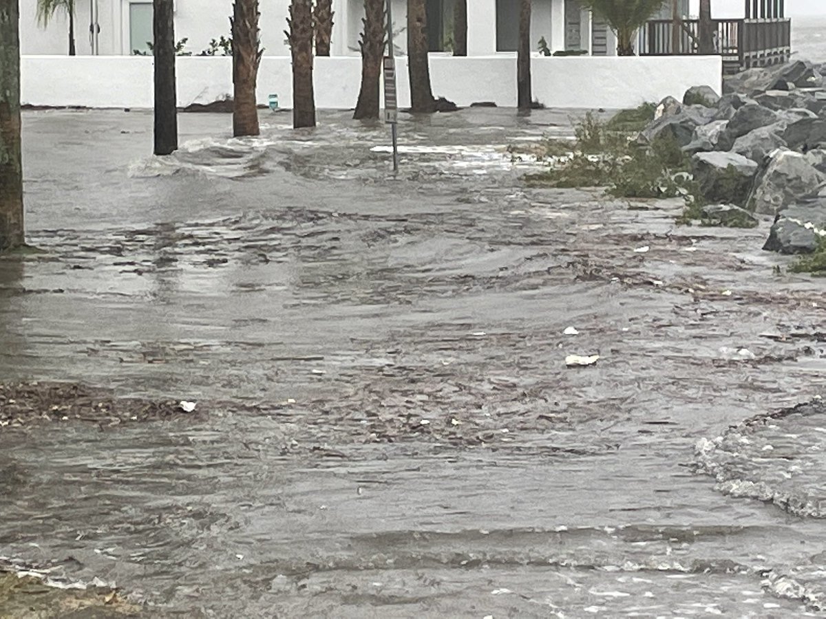 Nicole flooding St. Simons' Neptune Park. Waves crashing over rocks. Pier closed to the public.