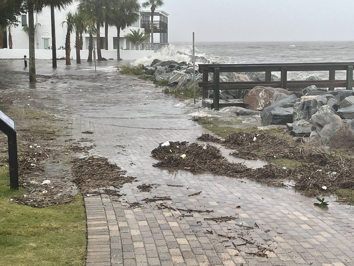 Nicole flooding St. Simons' Neptune Park. Waves crashing over rocks. Pier closed to the public.