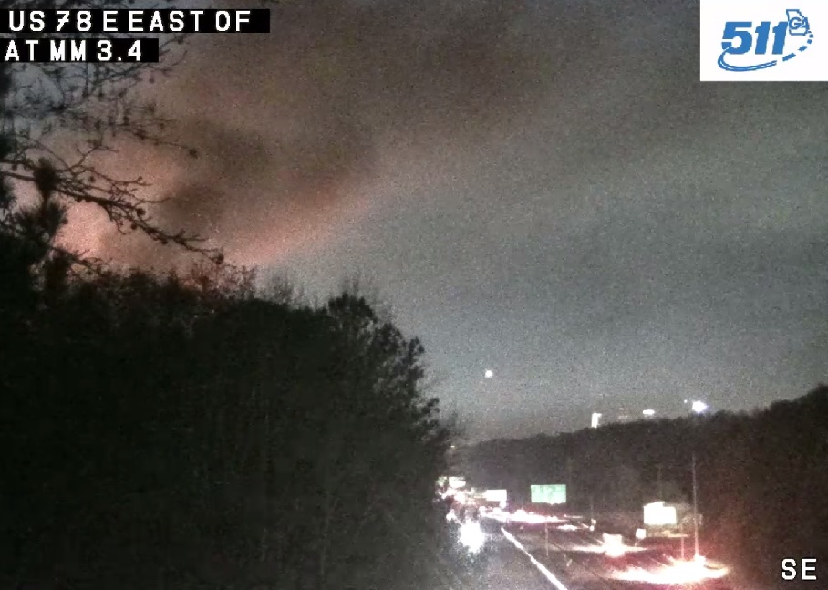 Smoke and flames billowing over the Stone Mtn Fwy. Active apt. fire off Brockett Rd. at The Ellis Apartments.