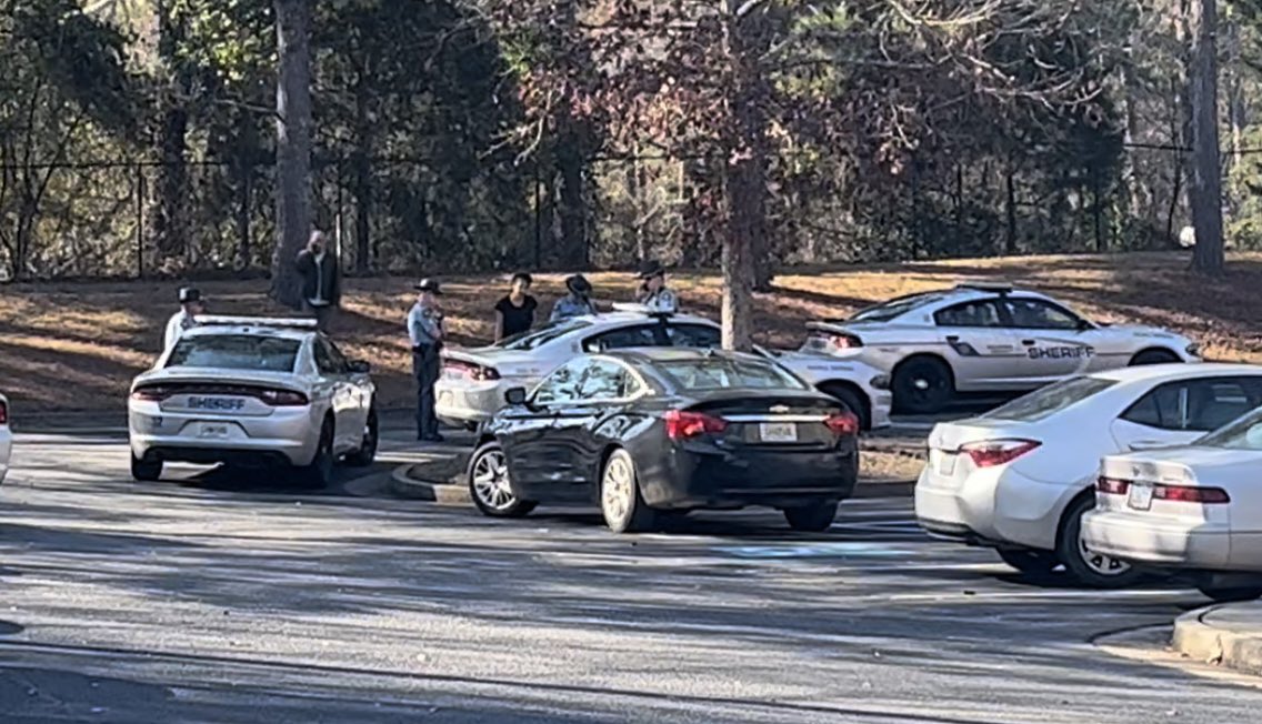 Large police presence at the Belmont Apartments in Columbia County. Both marked and unmarked vehicles on the scene.