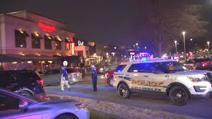 Food court argument at Perimeter Mall ends with suspect shot & in custody-at least 2 shot  After mall shooting, law enforcement units raced to apartment building off Pleasantdale Rd, where multiple policemen and at least one ambulance in the parking lot