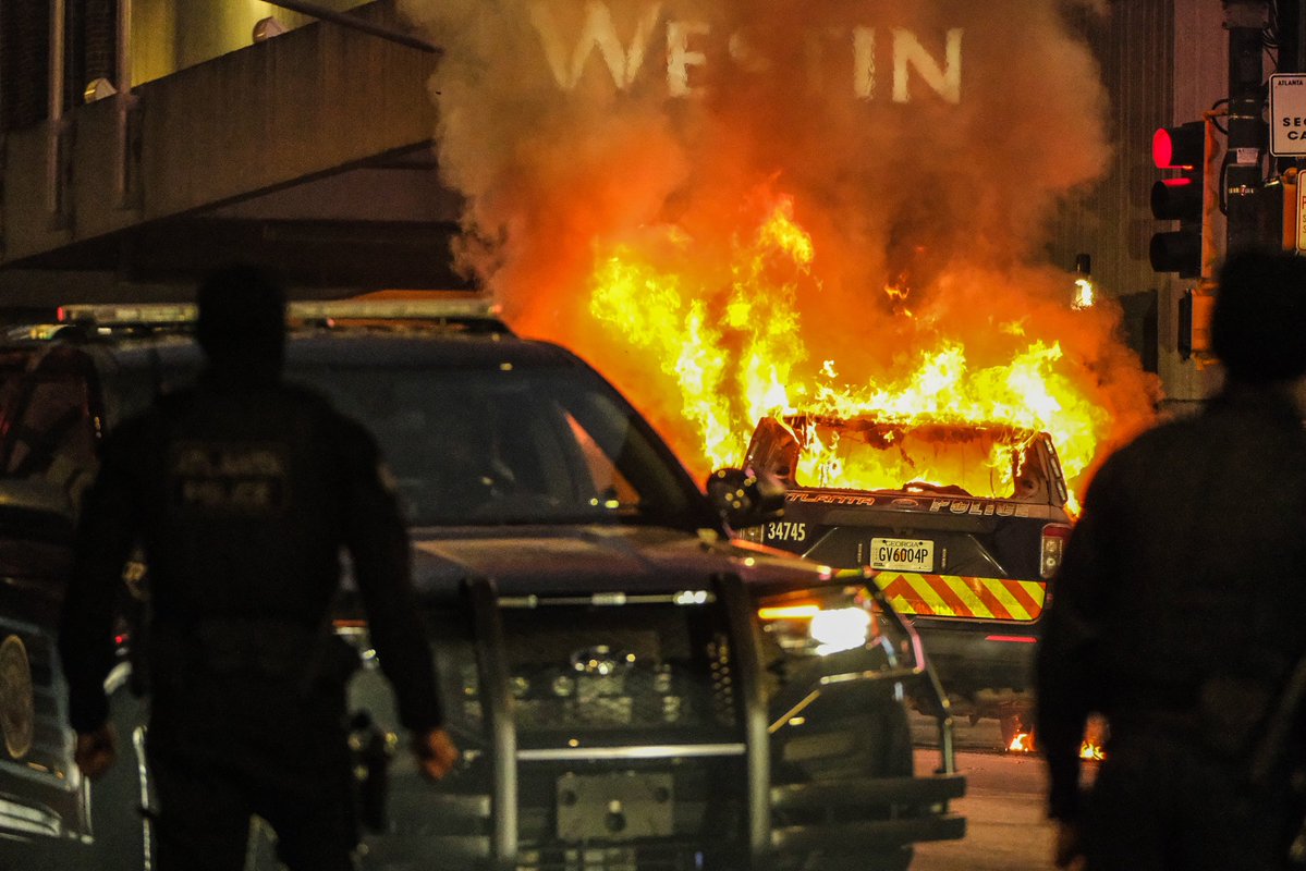 ATLANTA RIOT: More images from downtown Atlanta tonight after a Cop City protest became a riot. A number of businesses were vandalized and a City of Atlanta Police Department Vehicle was set ablaze. Continued coverage on @FOX5Atlanta breaking news atl atlantaprotest