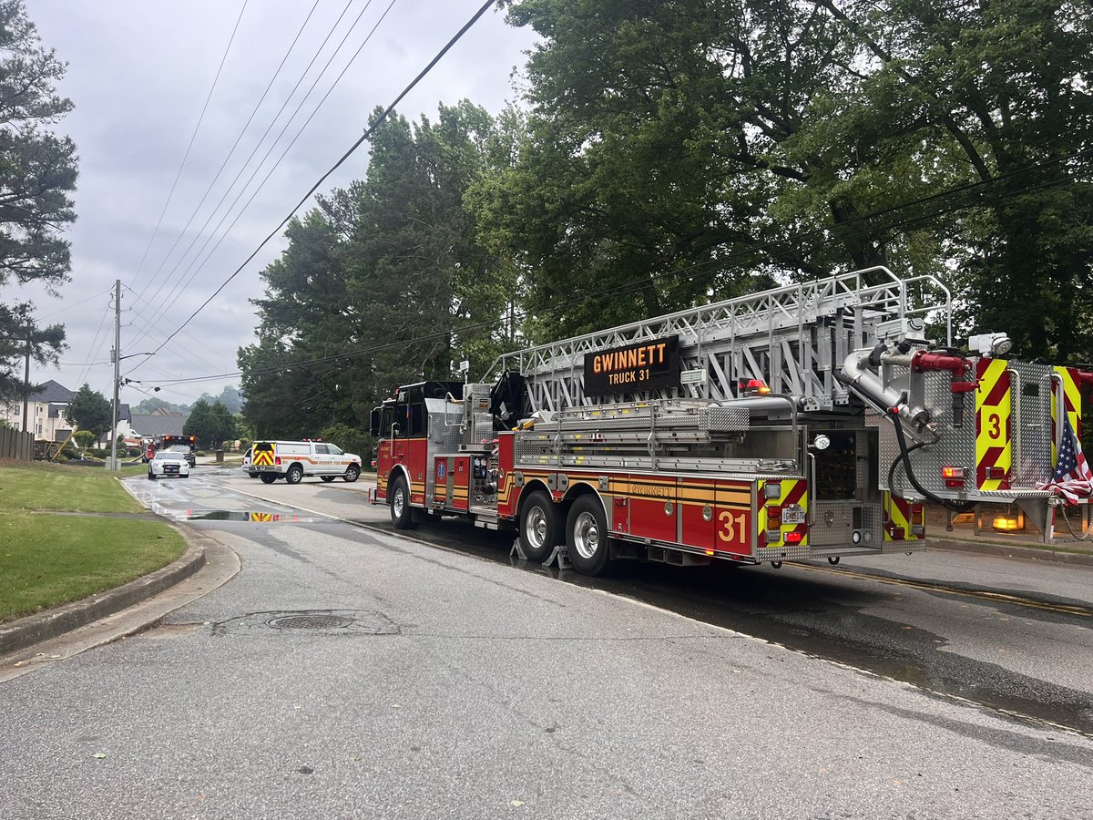 Gwinnett County Firefighters have their work cut out for them in Lawrenceville: they're battling a house fire on Lebanon Road way off the road. They're having to use a helicopter to dump water on the flames