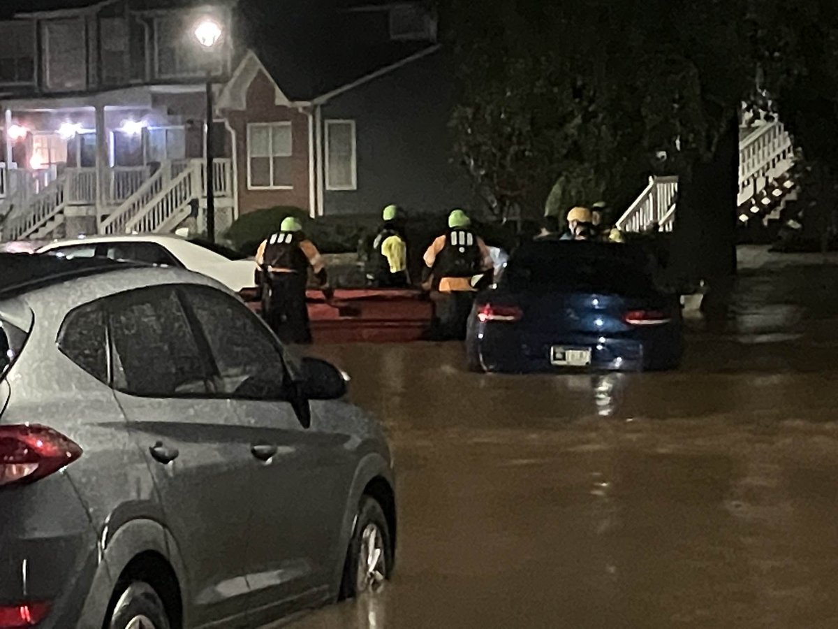 Atlanta fire crews are rescuing residents from their apartments near Buckhead.