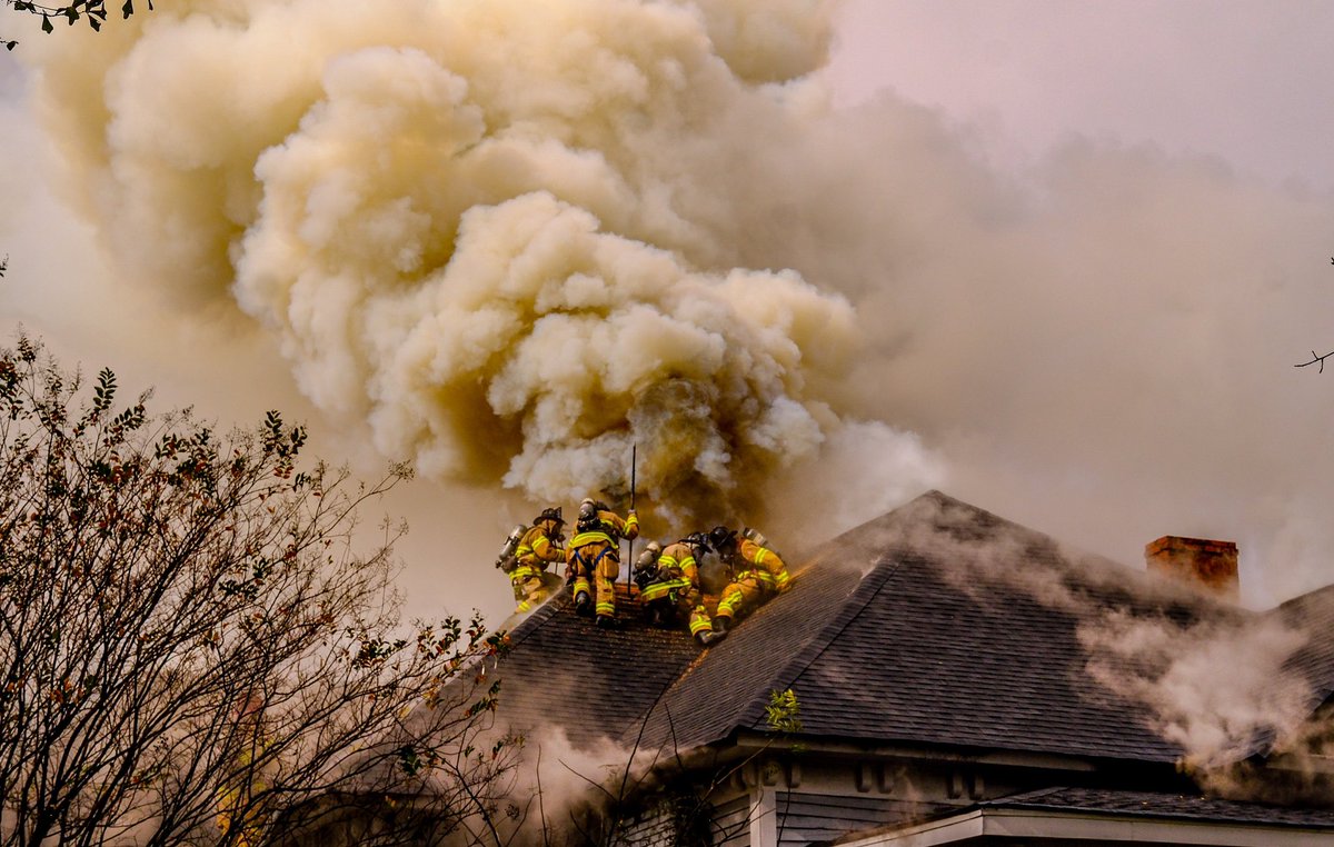 DeKalb Firefighters scaled the roof of this home in Stone Mountain and battled  flames and an overwhelming tower of smoke, saving what they could of the structure. They work to protect life and property, in that order. The homeowner escaped the blaze